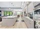 Spacious kitchen with stainless steel appliances and a large island with bar seating at 4581 Majestic Hills Loop, Brooksville, FL 34601