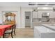 Open floor plan features kitchen with an island and stainless steel appliances, plus dining space at 4581 Majestic Hills Loop, Brooksville, FL 34601