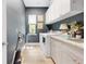 This laundry room features ample counter space and natural light at 4581 Majestic Hills Loop, Brooksville, FL 34601