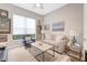 Cozy living room featuring neutral tones, plush seating, and lots of natural light at 4581 Majestic Hills Loop, Brooksville, FL 34601