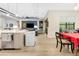 Open-concept living space with modern kitchen and dining area leading to the comfortable living area at 4581 Majestic Hills Loop, Brooksville, FL 34601