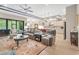 Open-concept living room with a view to the kitchen, eating nook, and outdoor areas at 4581 Majestic Hills Loop, Brooksville, FL 34601