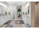 Bright bathroom featuring dual vanities and plenty of storage with convenient access to the main bedroom at 4581 Majestic Hills Loop, Brooksville, FL 34601