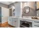 Elegant bathroom featuring a double vanity, marble countertops, and modern fixtures at 5010 Umber N Way, Tampa, FL 33624
