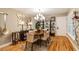 Stylish dining area featuring a modern light fixture and curated shelving at 5010 Umber N Way, Tampa, FL 33624