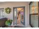 Inviting foyer with decorative glass door, staircase, and warm interior lighting at 5010 Umber N Way, Tampa, FL 33624