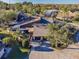 Beautifully landscaped home with a private entry, mature shade trees, and a two-car garage in a desirable neighborhood at 5010 Umber N Way, Tampa, FL 33624