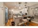 Modern kitchen with stainless steel appliances, white cabinetry, and hardwood floors at 5010 Umber N Way, Tampa, FL 33624