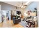 Bright living room features hardwood floors, fireplace with TV, vaulted ceilings, and modern decor at 5010 Umber N Way, Tampa, FL 33624
