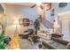 Inviting living area with staircase, hardwood floors, neutral paint, and comfortable seating at 5010 Umber N Way, Tampa, FL 33624