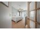 Bedroom with a ceiling fan and doors leading to the exterior at 5519 Greyston St, Palm Harbor, FL 34685