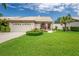 Charming single-story home with lush lawn and manicured landscaping at 5519 Greyston St, Palm Harbor, FL 34685
