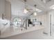 Bright kitchen featuring white cabinets, stainless steel appliances, and modern countertops at 5519 Greyston St, Palm Harbor, FL 34685