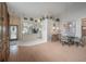 Open-concept layout with dining area, kitchen view, and decorative accents at 5519 Greyston St, Palm Harbor, FL 34685