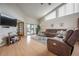 Spacious living room with tall windows, a comfortable sectional sofa, and an open layout at 5519 Greyston St, Palm Harbor, FL 34685