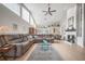 Spacious living room features high ceilings, fireplace, neutral paint, and lots of natural light at 5519 Greyston St, Palm Harbor, FL 34685