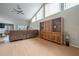 Bright living room with vaulted ceilings, entertainment center and comfortable sofa at 5519 Greyston St, Palm Harbor, FL 34685