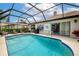 Enjoy this backyard pool with an attached spa, BBQ grill, patio space, and manicured landscaping at 5519 Greyston St, Palm Harbor, FL 34685