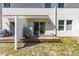 Backyard featuring a wooden deck and lush green grass at 6406 Sanctuary Creek Ln, Tampa, FL 33625