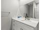 Modern bathroom featuring tiled shower, and sleek sink and vanity area at 6406 Sanctuary Creek Ln, Tampa, FL 33625