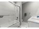 Bathroom featuring tiled shower and bathtub, and a modern sink and vanity area at 6406 Sanctuary Creek Ln, Tampa, FL 33625