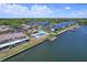 Aerial community view along the water highlighting a neighborhood pool and private boat docks at 6490 Cape Hatteras Ne Way # 4, St Petersburg, FL 33702