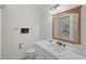 Cozy bathroom featuring marble countertops and a sink with storage at 6490 Cape Hatteras Ne Way # 4, St Petersburg, FL 33702