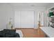 Bright bedroom featuring a large closet, window with blinds, desk and storage at 6490 Cape Hatteras Ne Way # 4, St Petersburg, FL 33702