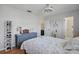 Bedroom featuring wood floors, closet, and ensuite bathroom at 6490 Cape Hatteras Ne Way # 4, St Petersburg, FL 33702