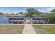 Community wooden dock offers access to the water and stunning views at 6490 Cape Hatteras Ne Way # 4, St Petersburg, FL 33702