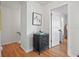 Hallway features wood floors, light colored paint, and easy access to rooms at 6490 Cape Hatteras Ne Way # 4, St Petersburg, FL 33702