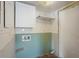 Functional laundry room with built-in shelves, awaiting completion at 6490 Cape Hatteras Ne Way # 4, St Petersburg, FL 33702