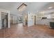 Open-concept kitchen and living area with tile flooring, access to appliances, and ample space for easy living at 6490 Cape Hatteras Ne Way # 4, St Petersburg, FL 33702