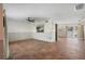 Spacious living room featuring tile floors and a sliding door offering natural light and access to the outdoor space at 6490 Cape Hatteras Ne Way # 4, St Petersburg, FL 33702