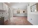 Spacious living room with terracotta tile flooring and sliding glass door to backyard at 6490 Cape Hatteras Ne Way # 4, St Petersburg, FL 33702