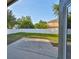 Spacious, partially shaded backyard features a concrete patio and a newer white vinyl fence at 6933 Waterbrook Ct, Gibsonton, FL 33534
