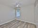 Comfortable bedroom featuring a ceiling fan, neutral walls, modern floors, and closet space at 6933 Waterbrook Ct, Gibsonton, FL 33534