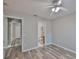 This bedroom features a ceiling fan, modern floors, and ensuite access at 6933 Waterbrook Ct, Gibsonton, FL 33534