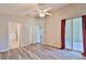 Spacious primary bedroom with modern floors and an ensuite bathroom, seamlessly blending comfort and convenience at 6933 Waterbrook Ct, Gibsonton, FL 33534