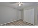 Nicely staged bedroom with laminate floors, neutral paint, ceiling fan and standard closets at 6933 Waterbrook Ct, Gibsonton, FL 33534