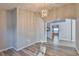 Dining space showcases an elegant chandelier and hardwood flooring with backyard views at 6933 Waterbrook Ct, Gibsonton, FL 33534