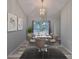 Bright dining room with elegant chandelier, modern table set, and beautiful artwork at 6933 Waterbrook Ct, Gibsonton, FL 33534