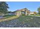 Well-kept single-story house with a spacious front lawn and driveway at 6933 Waterbrook Ct, Gibsonton, FL 33534