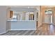 Open-concept kitchen with bar seating and stainless-steel appliances at 6933 Waterbrook Ct, Gibsonton, FL 33534