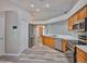 Modern kitchen boasts stainless appliances, ample cabinet space, and sleek countertops at 6933 Waterbrook Ct, Gibsonton, FL 33534