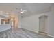 Bright living room connects to kitchen, boasts vaulted ceiling and neutral paint at 6933 Waterbrook Ct, Gibsonton, FL 33534