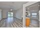 Bright, open living area with hard wood floors, a ceiling fan, and backyard views at 6933 Waterbrook Ct, Gibsonton, FL 33534