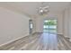 Open-concept living area with sliding glass doors and seamless access to the backyard at 6933 Waterbrook Ct, Gibsonton, FL 33534