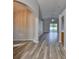 Open-concept living room featuring hardwood floors and sliding glass doors to the backyard at 6933 Waterbrook Ct, Gibsonton, FL 33534