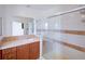 Bathroom featuring a shower with sliding glass doors and tiled vanity at 7647 Navigator Ct, Port Richey, FL 34668